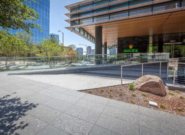 sidewalk view of Rolex Plaza front entrance